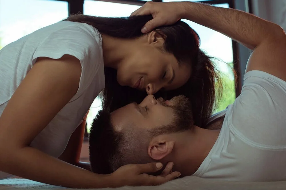 man and woman kissing